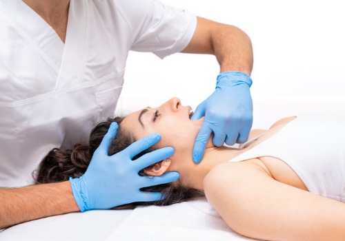 Woman laying back and undergoing myofunctional therapy with a dentist from The Smile Center of Peoria