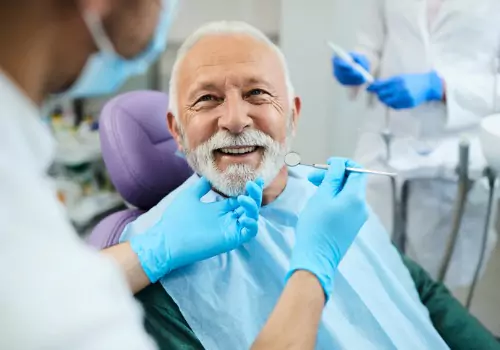 An elderly man undergoing Dental Exams in Peoria IL