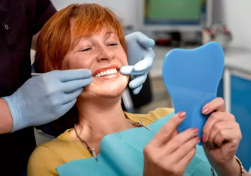 A woman admiring her recently finished Dentures in Peoria IL