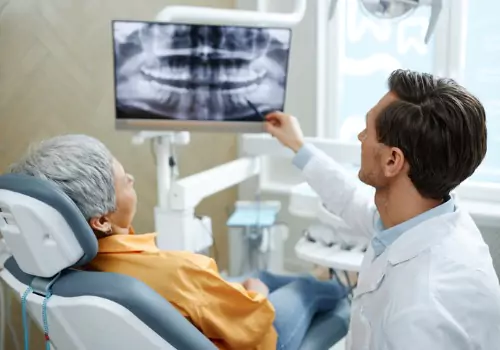 A woman being shown an x-ray of her teeth at a Dentist's Office in Peoria IL