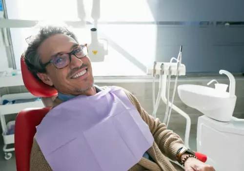 A man visiting a Dentist's Office in Peoria IL and waiting to have his teeth cleaned