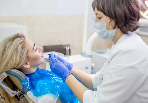 A dentist performing PRF Treatment for a patient in Peoria IL