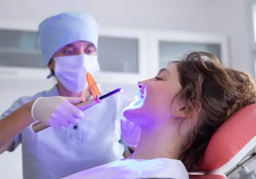 A woman is seen at a dental visit. The Smile Center offers Cosmetic Dentistry in Dunlap IL.